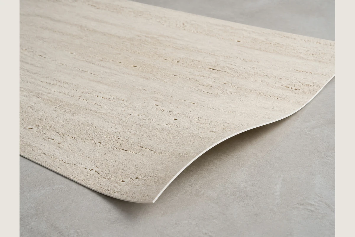 Light stone-look sheet with horizontal linear markings and a raised curved edge